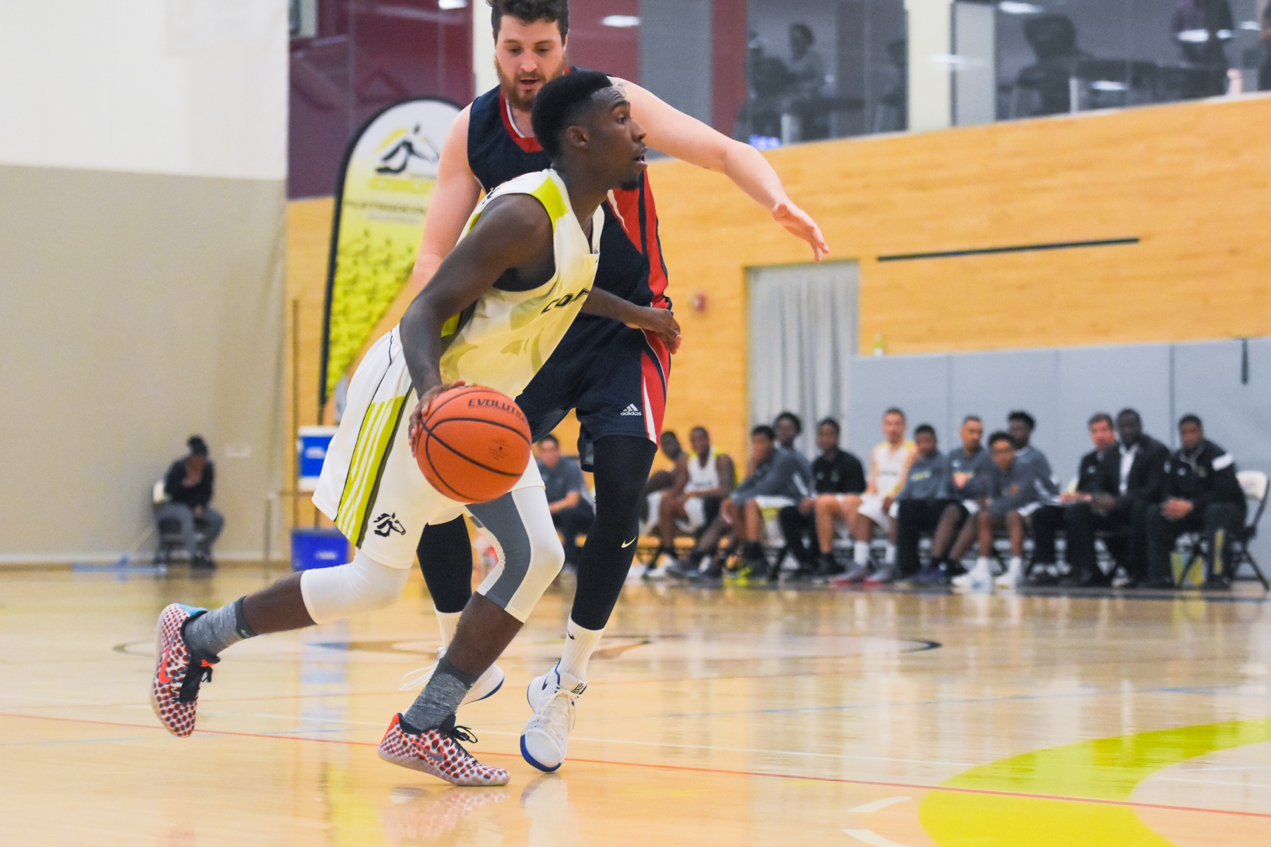 Centennial Colts point guard Jahshua McFarlane drives to the rim against a Loyalist Lancers defender. A second half defensive showcase led Centennial to an 88-64 blowout win against the Loyalist Lancers, at Athletic and Wellness Centre.