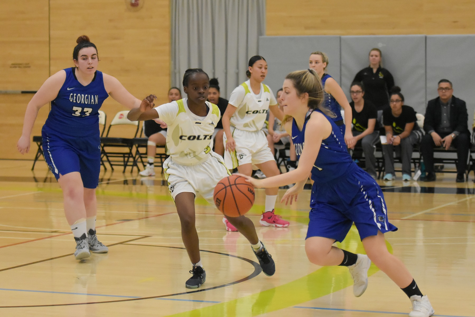 Centennial's Mariam Konate defends Georgian's Eden Young during first half action. Led by Konate's game high four steals and Judy Ta's game high 19 points, the Colts beat the Grizzlies, 70-35, for their first win of 2018. (Photo Credits: Khree Fearman/Colts Athletics)