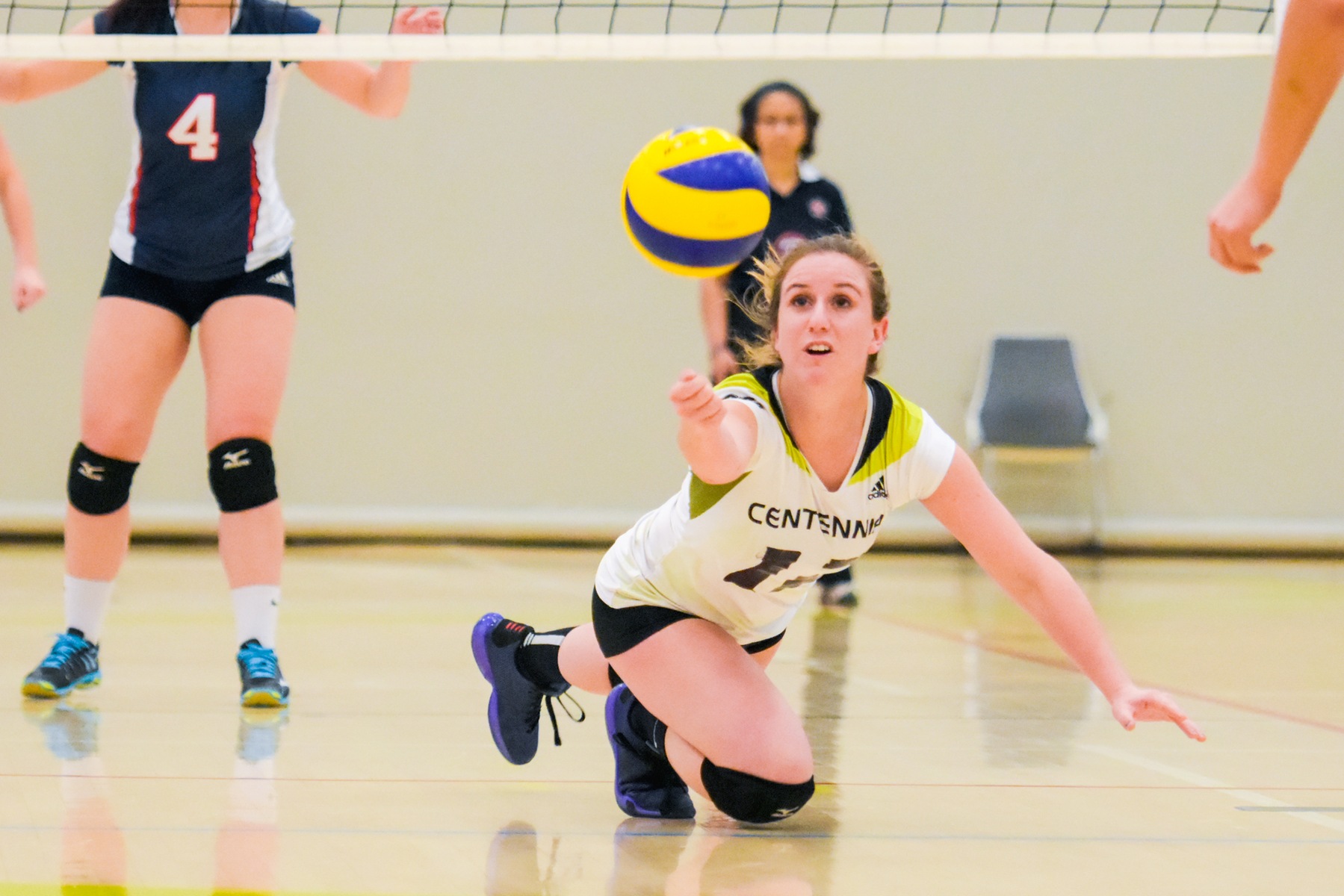 Colts women's volleyball player Brittany Somers dives after a ball.